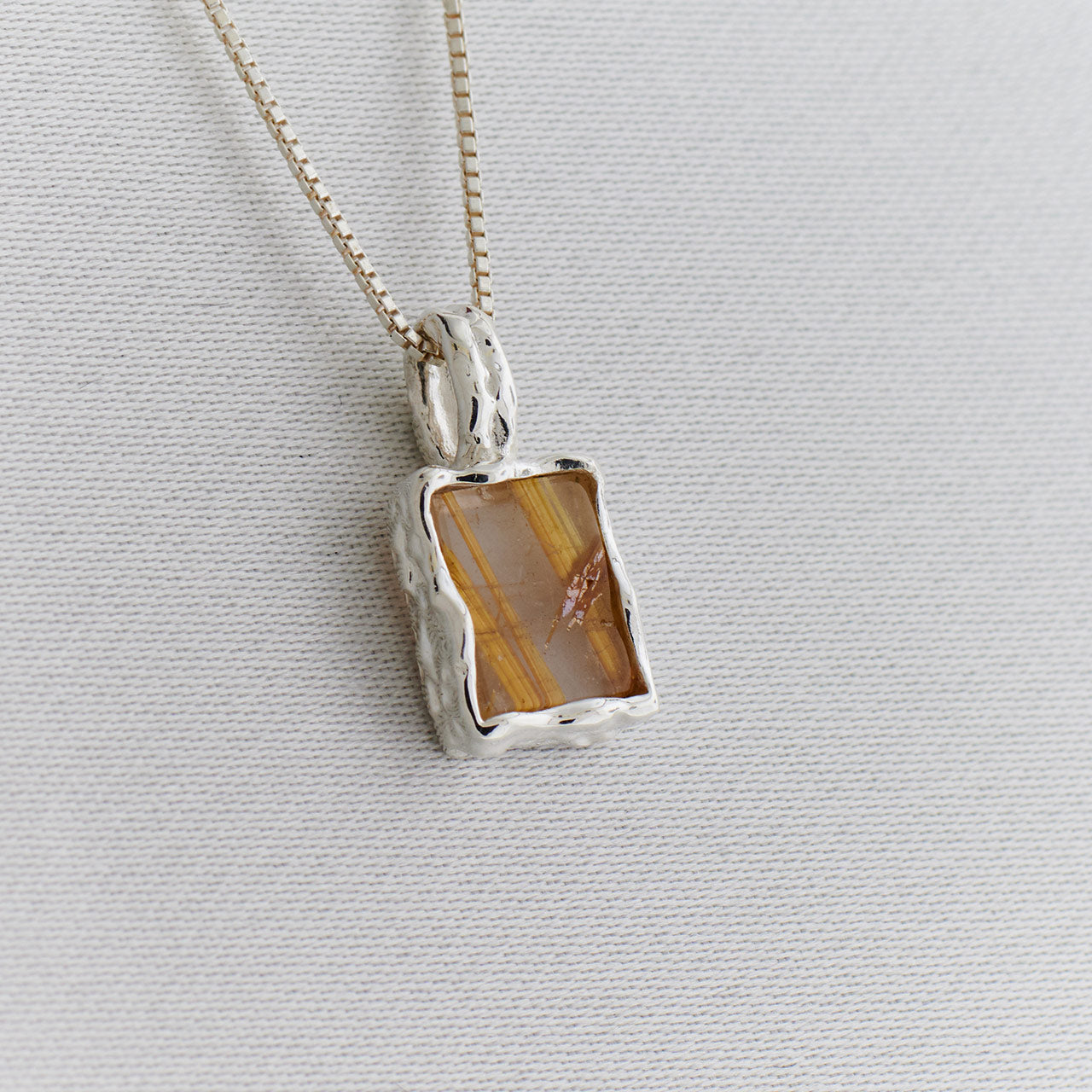 GOLDEN RUTILE STERLING SILVER REC HAMMERED FINISH PENDANT